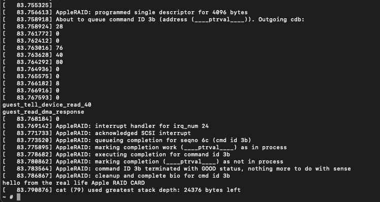 screenshot of terminal output with a bunch of kernel output and the line "hello from the real life Apple RAID Card" at the bottom, output from the cat command.
